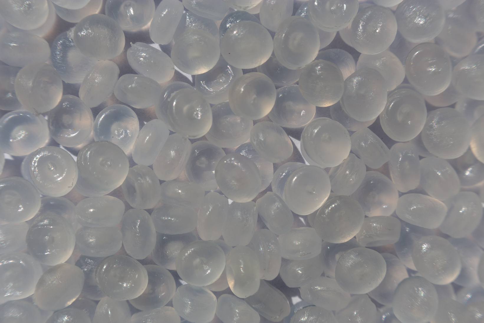 Close-up of plastic polymer granules. hand hold Polymer pellets. polymer plastic. compound polymer.